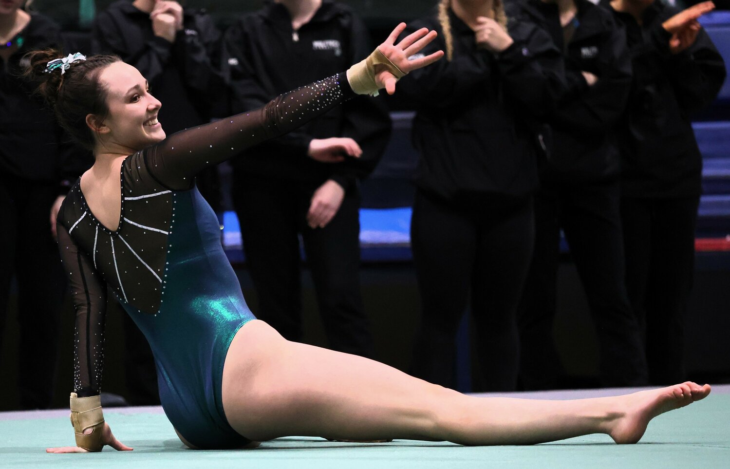 Emily Dahlstrom is all smiles as she competes on the floor, earning a score of 9.475 Thursday.