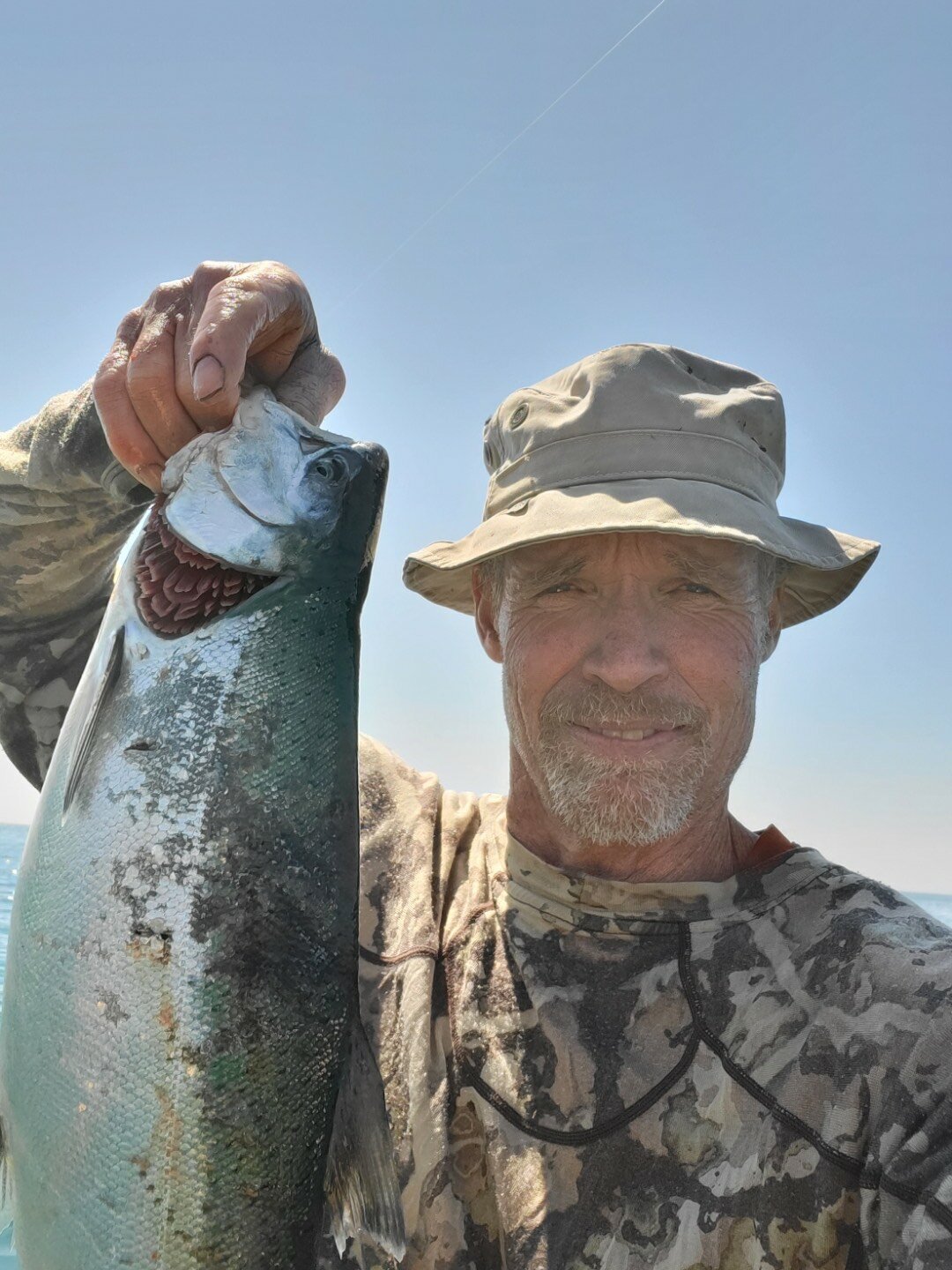 This coho hit a crankbait Walters was pulling while paddle trolling with his canoe on Lake Michigan at Port Washington.