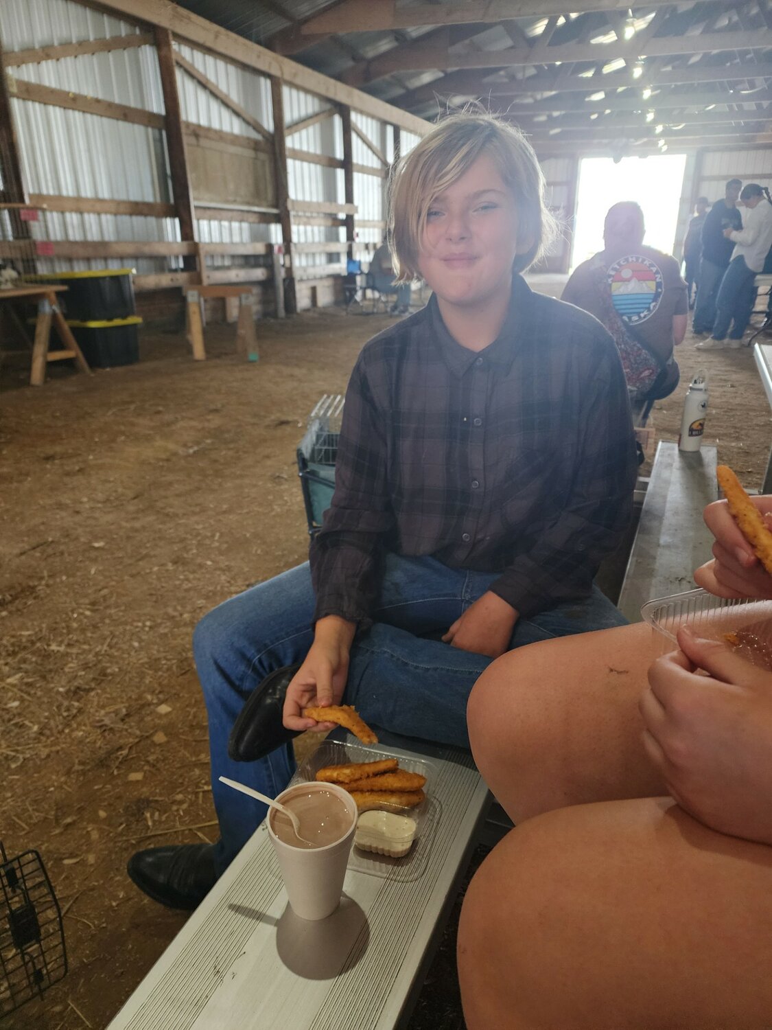 Harper Tufenk, age 11, River Falls, enjoyed the famous 4-H Food Stand chicken strips during the rabbit show on Tuesday, Aug. 6.