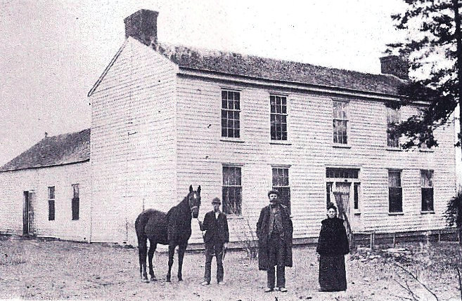 The Barnett Hotel as it looked when Lincoln stayed there. The building still stands on the top of the hill in Grandview and is a private home. The people are identified as Dan Whitcher, Shelby Green and Mary Ellen Redmon Green, and the photo was taken when the house was known as the Redmon-Green home.