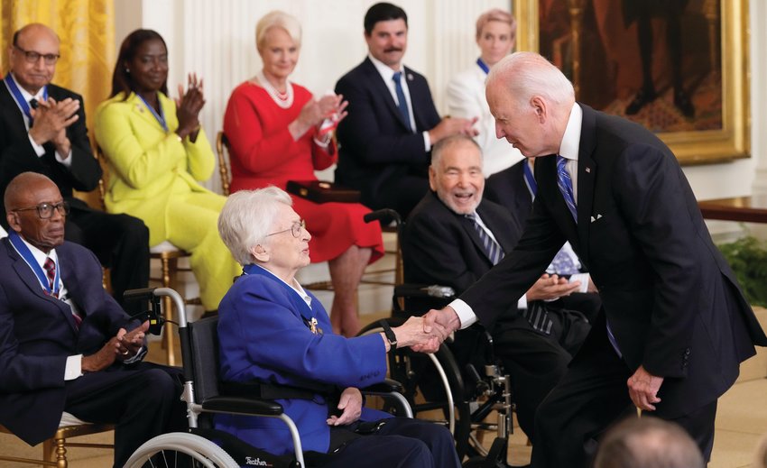 President Joe Biden shakes hands with General Wilma Vaught after presenting her with the Presidential Medal of Freedom. Vaught, who grew up on a family farm near Scottland in Edgar County, had a 28-year career in the Air Force advancing in rank from second lieutenant to brigadier general. She is credited with pioneering multiple breakthroughs for women in the military and blazing a path for others to follow.