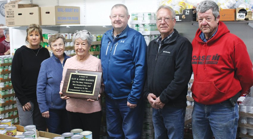 For more than three decades John and Kay Haddix helped the community through the Compassionate Food Ministry. A plaque in their honor was recently dedicated at the food pantry. Pictured left to right are, Brenda Wright, Sharon Aitken, Gladys Frost, Dirk Haddix, Tim Haddix and Jeff Haddix.