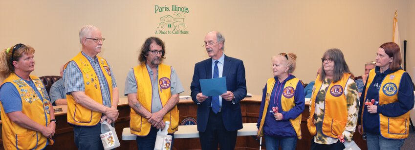 Paris Mayor Craig Smith reads a proclamation honoring the Lions Club for its work helping the visually and hearing-impaired population in both Edgar County and the state. The proclamation declared April 28 and 29 as Lions Tootsie Pop Days in Paris. Lions Club members will be at the intersections of Jasper and Main and Jasper and Central those days, selling Tootsie Pops to passing motorists.