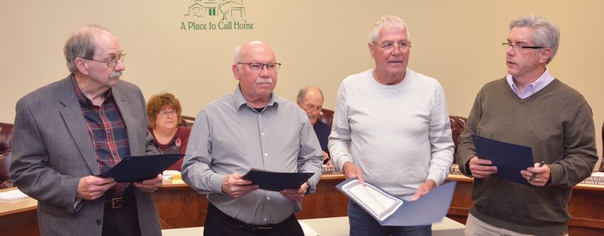 The reelected Paris city commissioners recited the oath of office together during the April 24 city council meeting. Left to right, Paul Ruff, Harry Hughes, Jerry Branson and Doug Hasler.