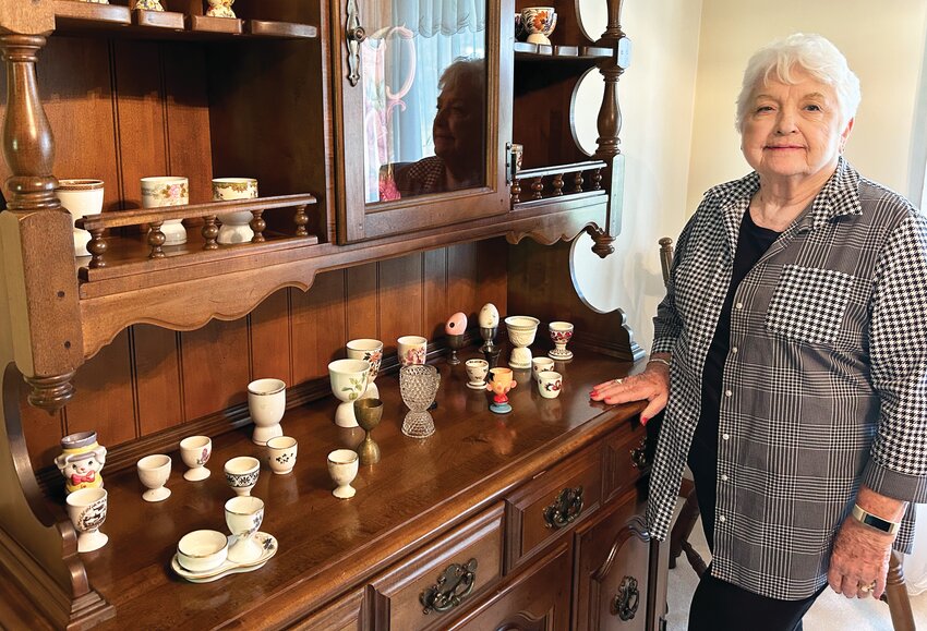 Clella Camp with a portion of her egg cup collection. Camp started collecting egg cups when she was 10 and many are souvenirs of her travels as an adult.