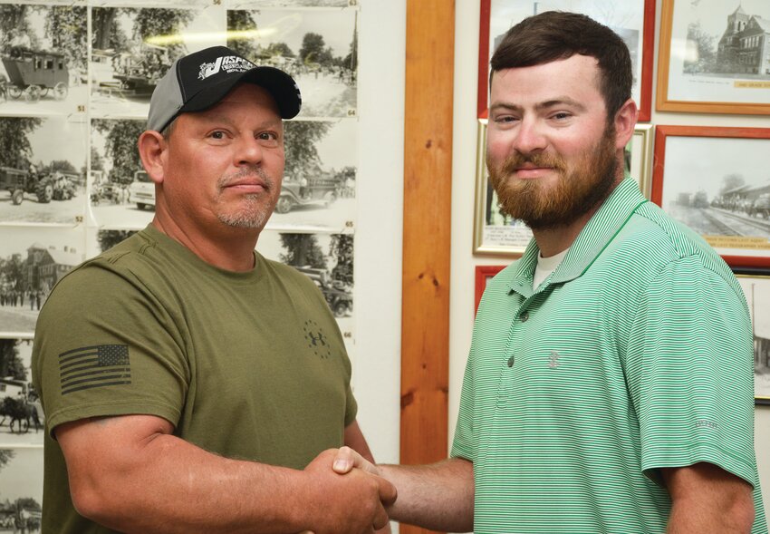 Mike Eads, left, ended an 18-year stint as president of the Hume Village Board Tuesday, May 30. He has moved to a new home outside the village limits prompting his resignation. The village board appointed trustee Seth Eads to fill remaining two years of the unexpired term of village president.