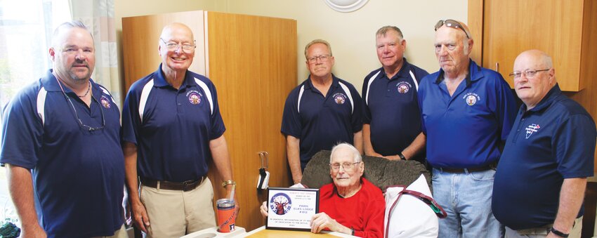 Members of the Paris Elks Lodge #812 present Robert &ldquo;Doc&rdquo; Sprague with a plaque recognizing his 77 years of service to the Elks. Left to right are, Left to right are, Chad Stevens, Al Speicher, Ray Korte, Jim Cooper, Don Humphrey, Greg Irwin and Sprague, seated.