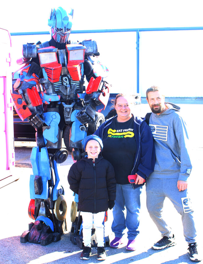 Optimus Prime appeared with I Heart Cookies for a meet and greet in Paris on Thursday, Nov. 2. Pictured left to right are Lucas Peak, Shelly Lawlyes and Charles Edmondson.
