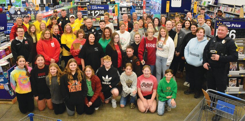 Volunteers of every age, occupation and background joined forces during the 31st annual Edgar County Shop With A Cop event on Saturday, Dec. 9.  According to Paris Police Chief Terry Rogers, this year's turnout was one of the best he has seen.