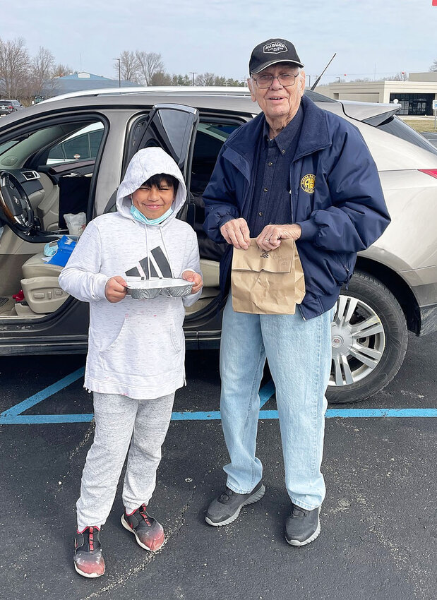 Tom Dunn has been volunteering with Meals on Wheels since 2008. Dunn is seen above (right) with his grandson (left) making deliveries to home-bound individuals via Horizon Health&rsquo;s Meals on Wheels program.
