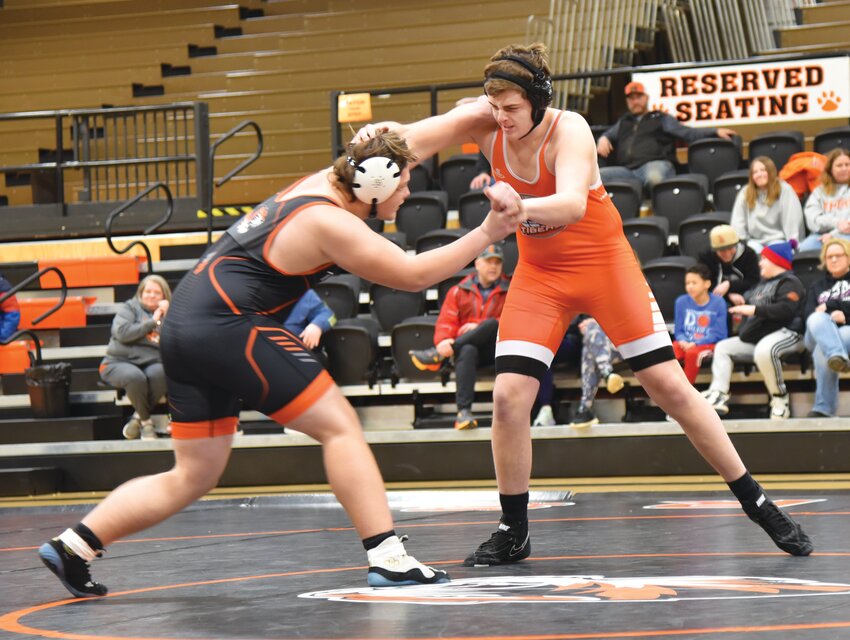 Jase Adkison, right, looks for an opening against his opponent during a recent wrestling match.