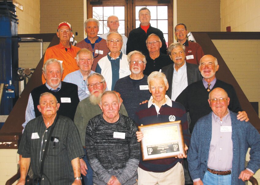 The undefeated (9-0) 1963 Paris Tiger football team was enshrined in the Paris High School Athletic Hall of Fame Saturday, Feb. 10. Accepting the plaque was Coach Doglio (center front, holding plaque), who made the trip for the occasion with three of his four daughters.