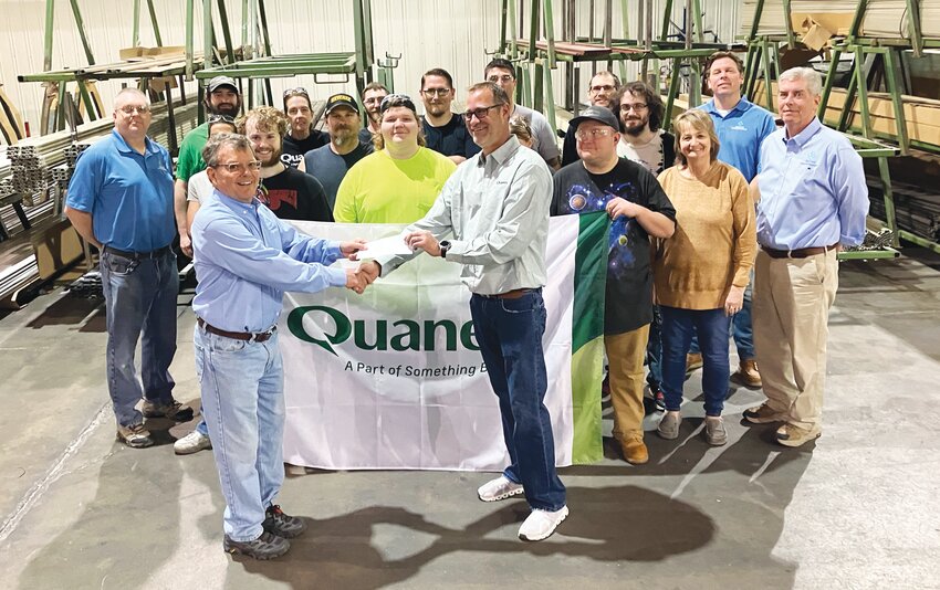 Quanex plant manager, Kenny Quinn (front, left) represented his employees and presented a check to Bob Morris (front, right) for the Edgar County Community Foundation&rsquo;s Forever Fund. The Forever Fund supports community and county positive development.
