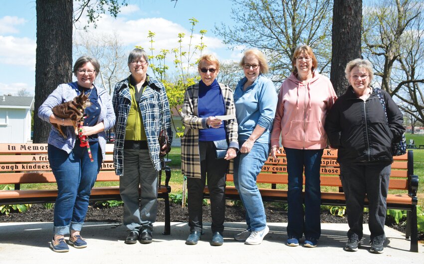 CK Nay&rsquo;s sister Dawn Lorey, far left, holding Taco the dog, and Janet Tracy, next to Lorey, presented the Edgar County Humane Society with a $303 check in honor of CK Nay during Saturday&rsquo;s event. Humane Society board members pictured are, from left to right, Mary Carriere, Tami O&rsquo;Bannon, Jayne Aitken and Cathy Hoyt.