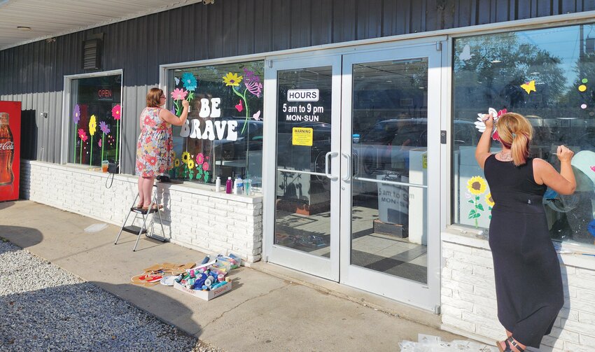 Ambrosia Branson, left, and Nicki Hanks, right, are two of the individuals who will be visiting various locations around Paris and painting inspiring messages of hope and positive affirmations on windows. The creative endeavor is part of a campaign to encourage conversations during Mental Health Awareness Month from the Edgar County ROSC.