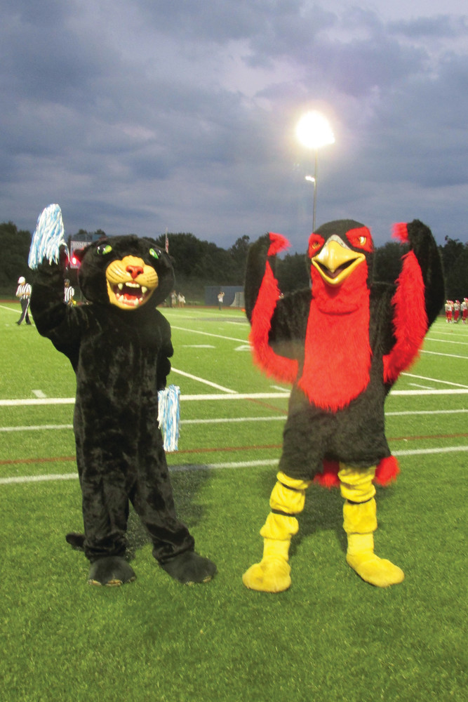 MIGHTY MASCOTS: Kathleen Jaroma, left, who proudly wears the Panther mascot outfit, joins Falcons mascot Matt Fyrer prior to last Friday&acirc;&euro;&trade;s kick-off.
