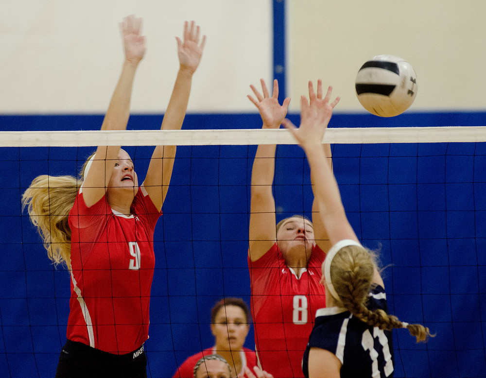 Townies teammates Patricia Hurley (left) and Ava Atwell attempt to block a volley.