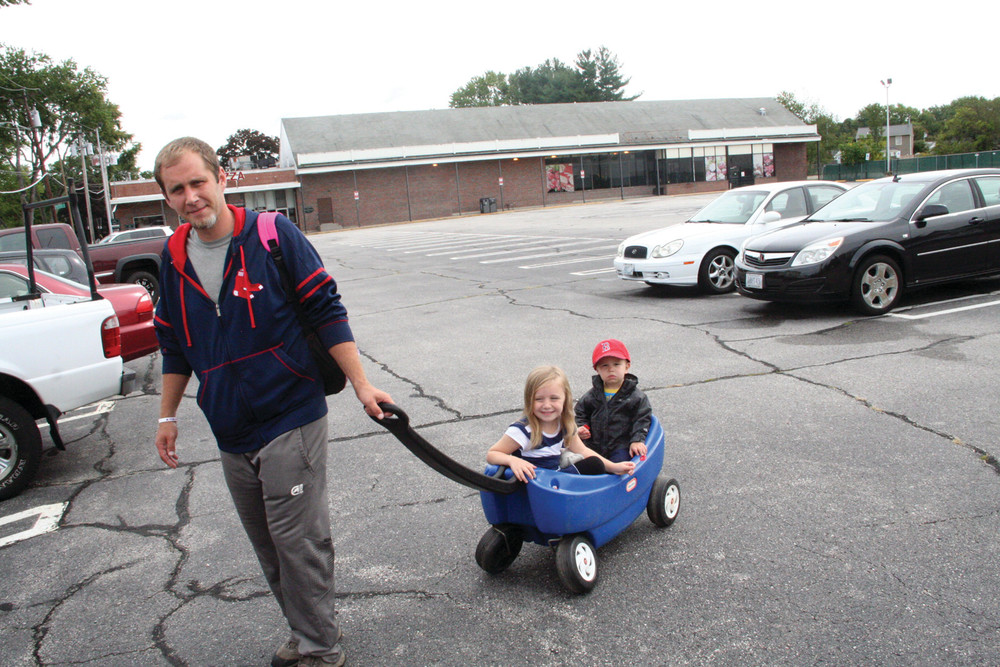 &acirc;&euro;&tilde;NICE TO HAVE AN OPTION&acirc;&euro;&trade;: Greg Phillips, who lives in the neighborhood of the planned Dave&acirc;&euro;&trade;s Marketplace, knows the property well, as he worked there when it was a Hi-Lo market. He has in tow his daughter, Bella, a pre-schooler at Little Shepard across Pontiac Avenue from the proposed store, and his son, J.J., who is two years old.