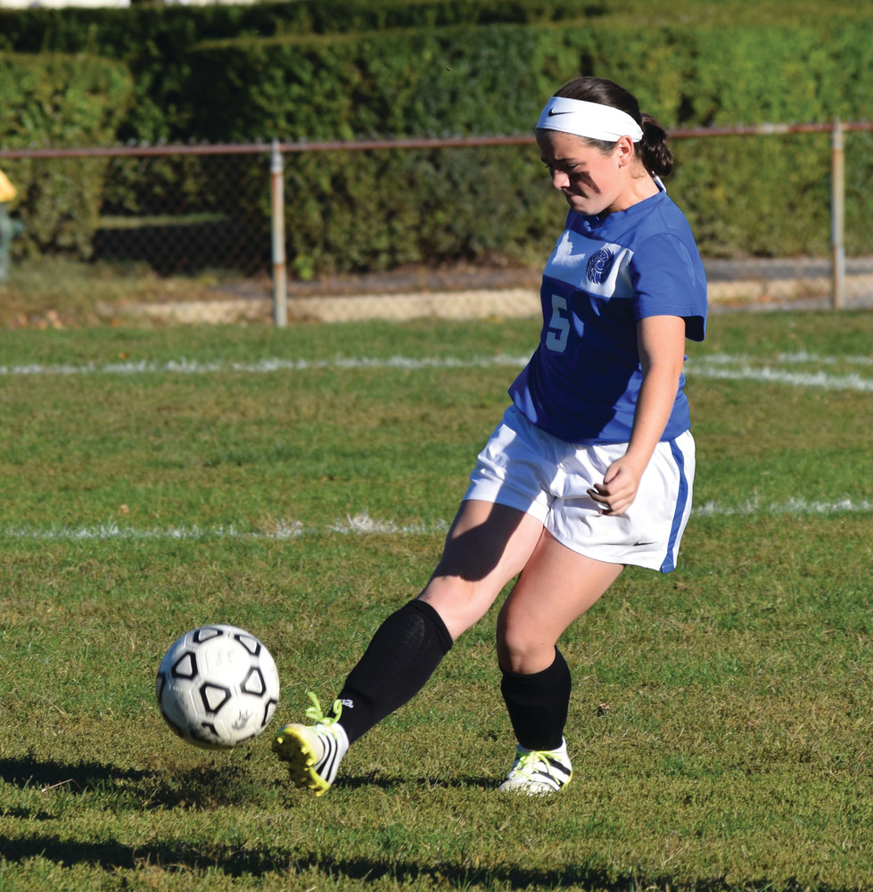 DEFENSIVE STALWART: Maddy D'Amato boots the ball away from Vets' side of the field during the opening minutes of Tuesday's game.