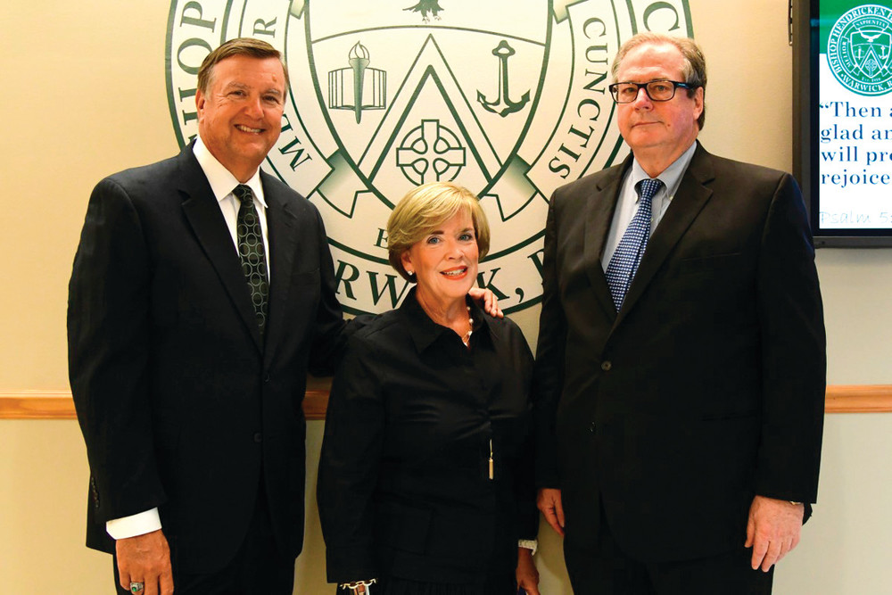 HENDRICKEN GIFT: Thomas Freeman, right, who recently donated $50,000 to the school is joined by Hendricken president John Jackson and Martha Murray, director of development.