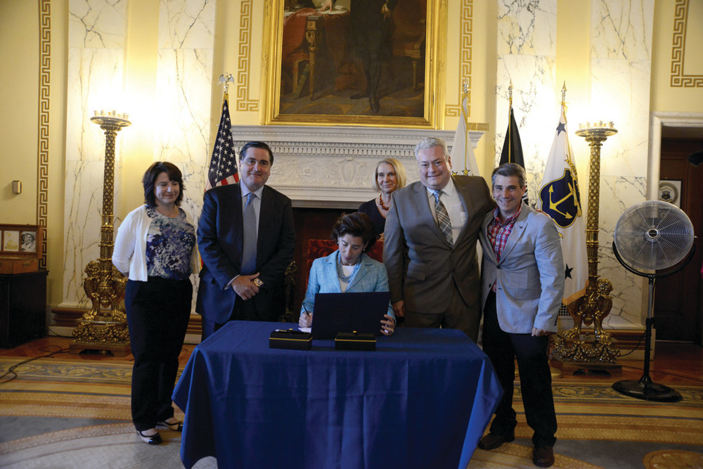 SPECIAL SIGNING:    From left, Sen. Gayle L. Goldin, Sen. Frank S. Lombardi, Gov. Gina M. Raimondo, Sen. Hanna M. Gallo, Rep. William W. O&rsquo;Brien, and Rep. Kenneth A. Marshall take part in a ceremonial bill signing of the legislation in the State Room of the State House.