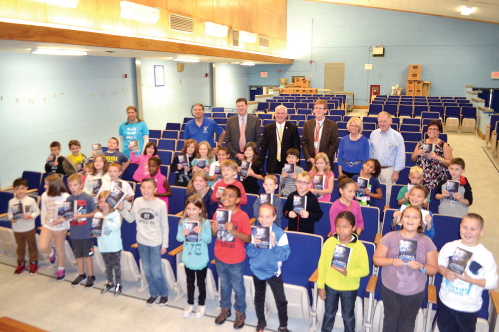 DICTIONARY DELIGHT: Lippitt&rsquo;s third graders, along with school and city officials, celebrate their gifts of donated dictionaries provided by the Warwick Rotary Club.