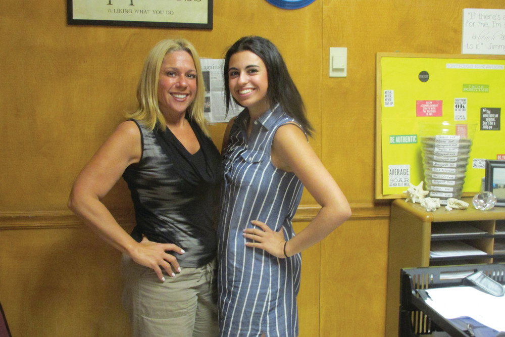 KEYNOTE SPEAKER: Johnston High School senior class president Gillian Melikian is all smiles while joining her guidance counselor, Mary Vingi, after graduation rehearsal earlier this week. Tomorrow night, she&rsquo;ll give the keynote address during graduation at PPAC.