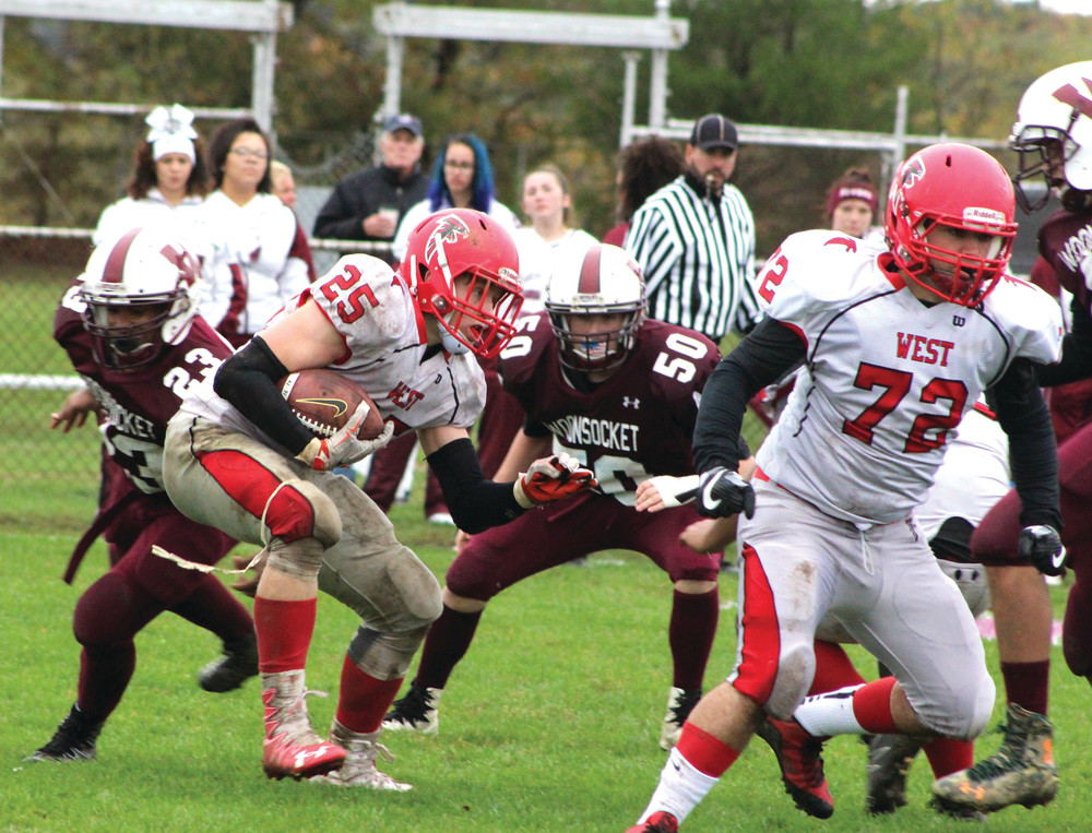 SUCH A MISMATCH: West running back Will Such maneuvers through Woonsocket's defense on Saturday. Such scored the eventual game-winning touchdown in the first half.