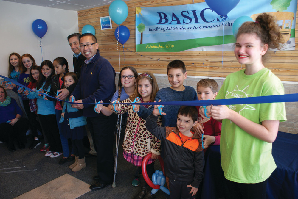 RIBBON CUTTING: Mayor Allan Fung and Ward 6 Councilman Mike Favicchio are seen during the ribbon cutting. Joining them were members of various BASICS programs who had safety scissors to help.