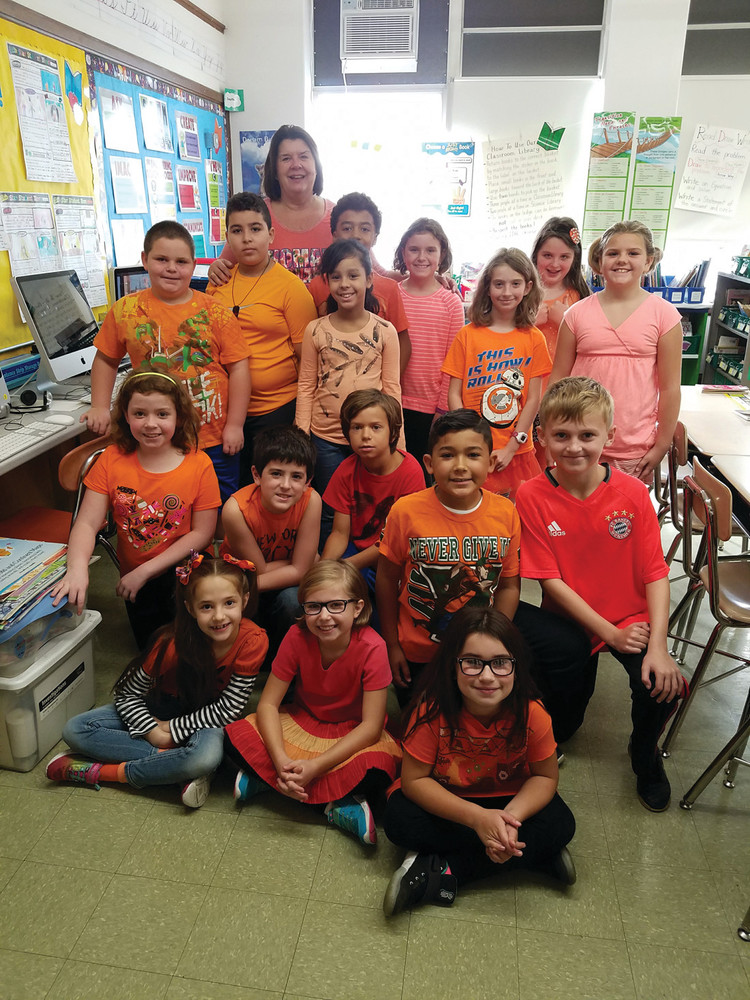RHODES ELEMENTARY SCHOOL had its Go Orange day on Oct. 21. Dawn Florenz&rsquo;s third-grade class had everyone in orange to raise awareness of childhood hunger. (Herald photos by Jen Cowart)