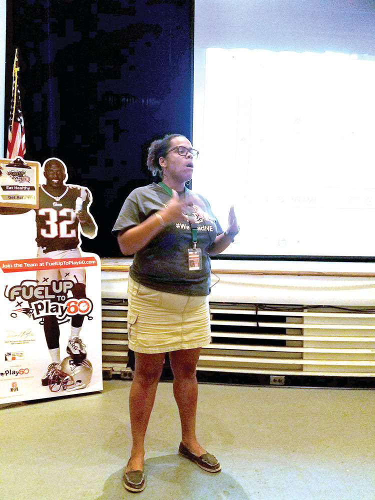 ISSUING THE CHALLENGE: Ayana Crichton spoke to the audience, explaining how the Fuel Up to Play 60 program has taken off at Bain Middle School and some of the incentives and programs in which the students will have the opportunity to be involved.