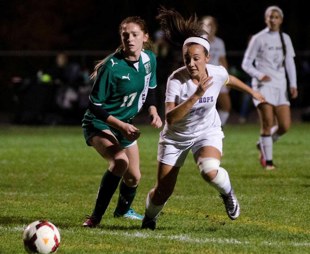 Huskies forward Michaela Goglia heads towards the goal for a scoring bid. The talented senior scored the 100th goal of her high school career during Friday night's 2-0 playoff win over Smithfield at Vendituoli Field.