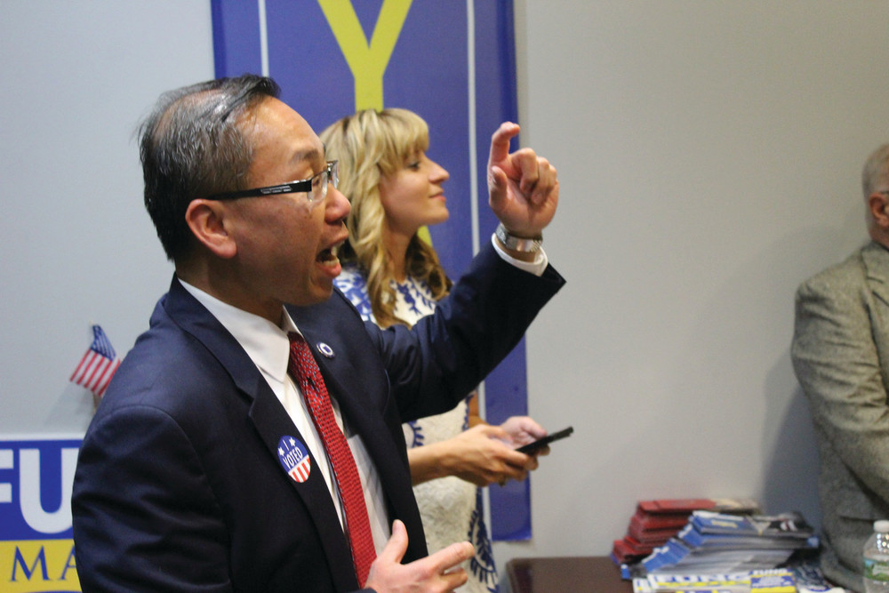 BIG WIN: Mayor Allan Fung, flanked by his wife Barbara Ann Fenton, speaks to supporters at his campaign headquarters following Tuesday&rsquo;s result.