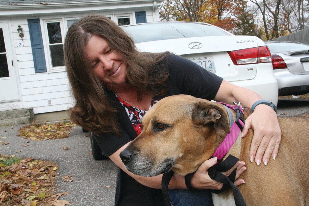 ONE OF TWO HEROES: Debbie Thornton credits her dog Baby with sounding the alarm that enabled the family to escape from their burning house on Oakland Beach Avenue Nov. 13. She also wants to nominate Jonathan Kane for an award. Kane was driving by the house and stopped to pull Debbie&rsquo;s granddaughter to safety.