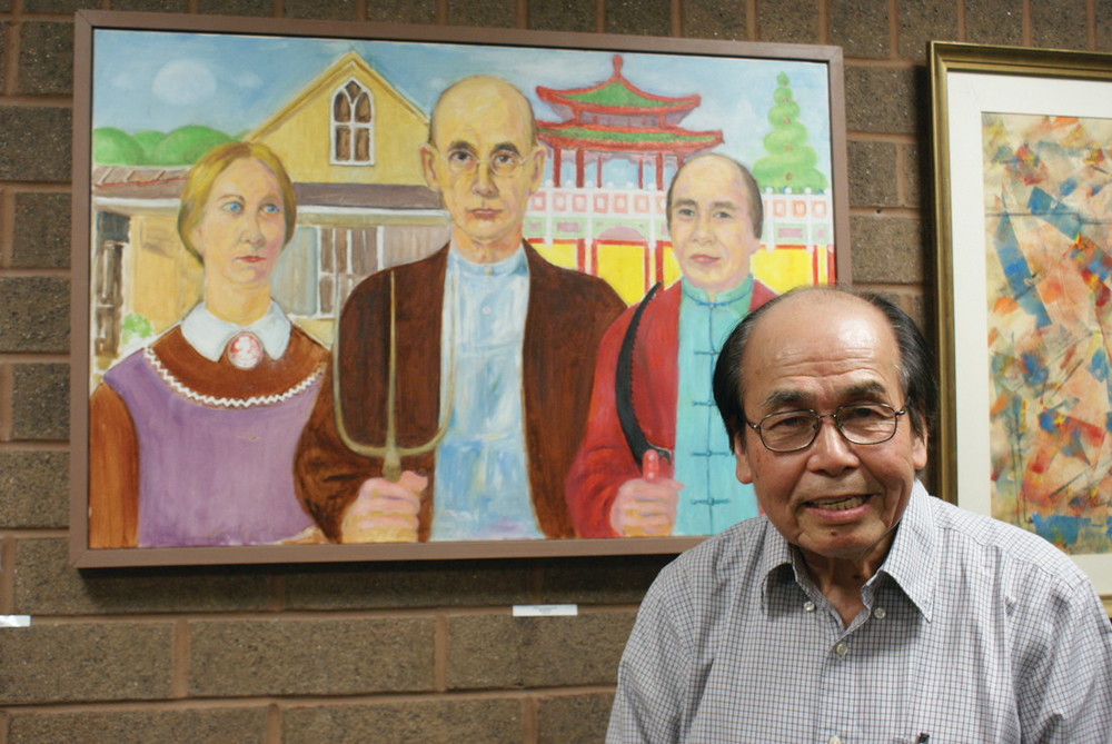CHINESE AMERICAN GOTHIC: Jack Lai, an artist who has featured his work at the New Hope Gallery, offers free portraits of seniors at the Cranston Senior Enrichment Center. He saw the painting &ldquo;American Gothic&rdquo; on a trip and repainted it an added himself into it.