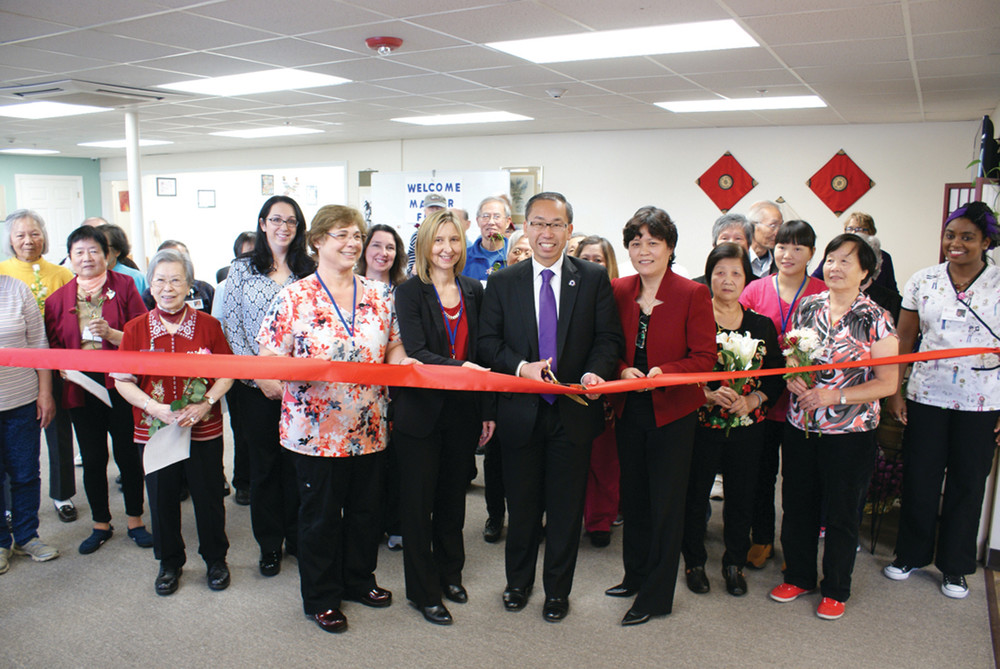 A RED RIBBON: Pictured holding the red ribbon for the Official Ribbon Cutting Ceremony of Park Avenue Senior Care are (l-r) Program Director JoAnna Pinga, Administer Kimberly Santilli, Mayor Allan Fung and owner Irene Qi.
