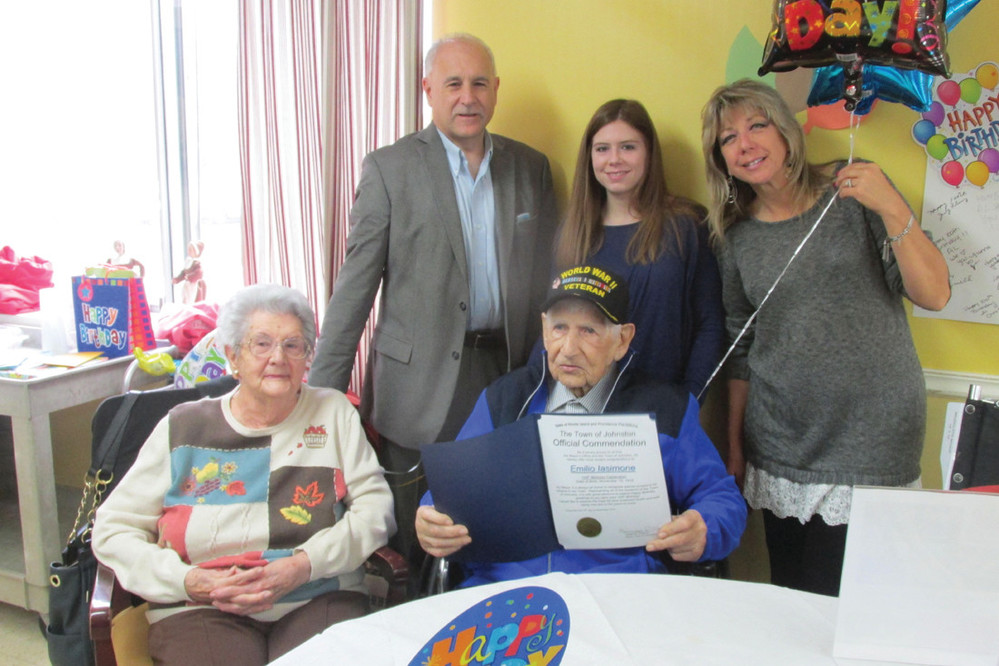 BIRTHDAY BOY: Emilio Iasimone, the newest members of Rhode Island&rsquo;s Centenarian Club, shows his Official Commendation from the Town of Johnston during Tuesday&rsquo;s 100th birthday celebration. He&rsquo;s joined by his friend Betty Kaye, Mayor Joseph Polisena, granddaughter Marissa Rose and daughter Helene Manish.