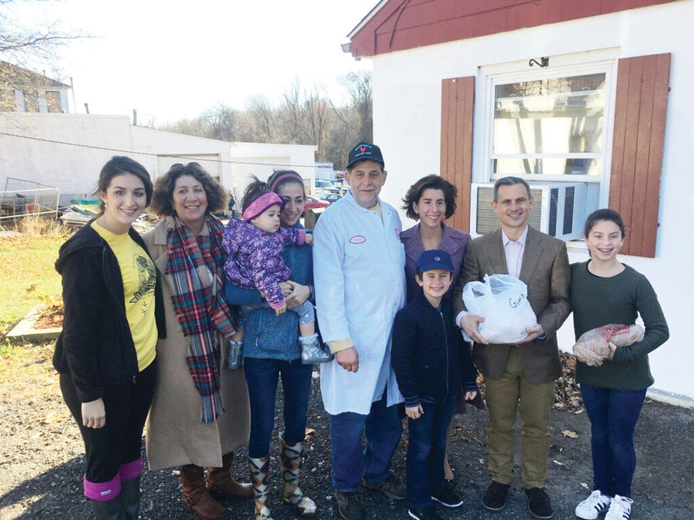 THE BAFFONIS AND RAIMONDOS: Celebrating a family tradition, the Baffoni family proudly presented a 20 pound turkey and fresh eggs for the governor&rsquo;s table.