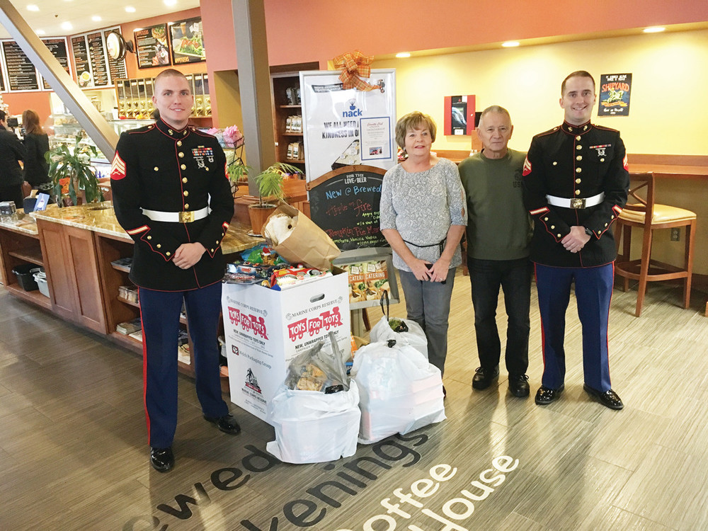 &quot;GOOD AND GENEROUS&quot;: From left, Sgt. Kyle White, Corvette Club members Jerry and Pat Picozzi, Corvette Club President and First Lady James and Rosemary Campanini, and Corp. Lonnie Crow at Brewed Awakenings Warwick's Toys for Tots donation boxes.