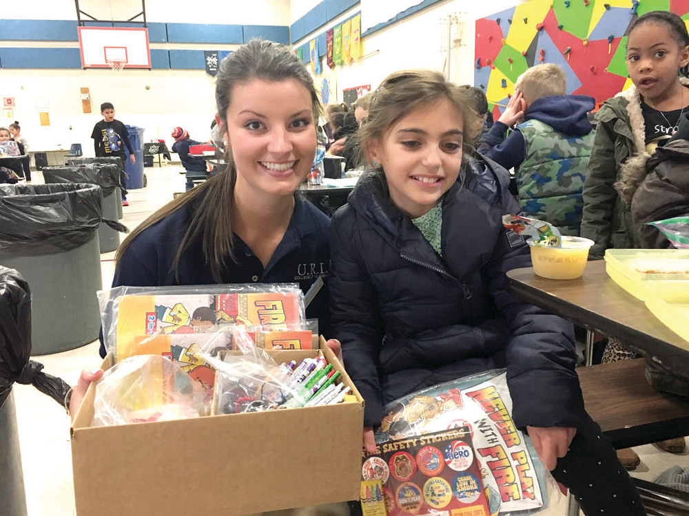 PICK YOUR PRIZE:    Rachel Hobbs lets fifth grader Ella Fitzpatrick choose something out of her &ldquo;treasure chest&rdquo; for bringing a healthy lunch.