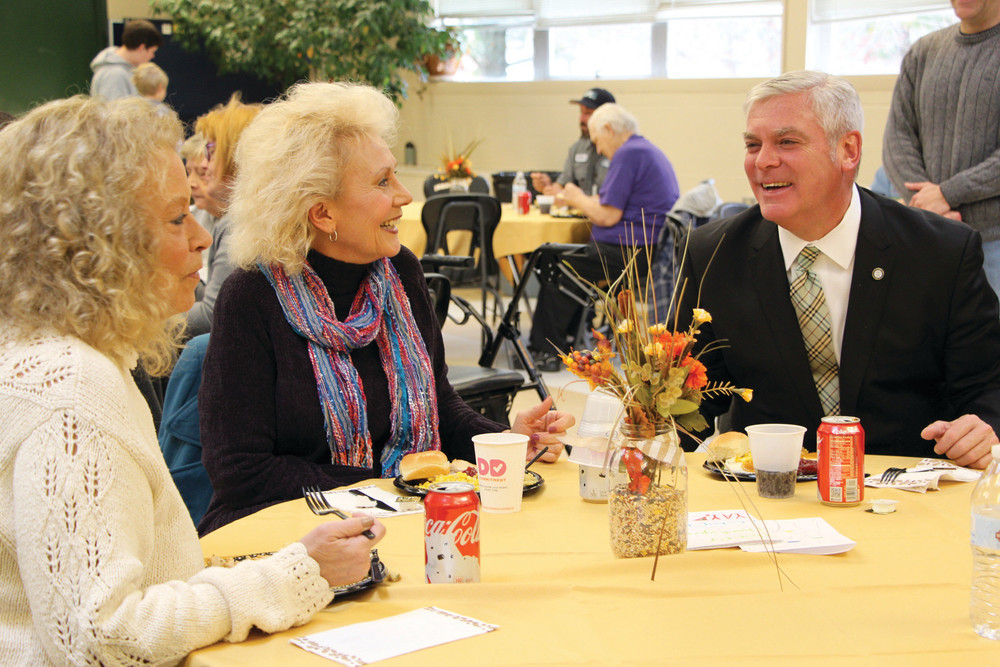 MAKING FRIENDS: Mayor Scott Avedisian talks with Patricia Antonelli and Paula Thibault, who met last year at the event and have remained friends since.