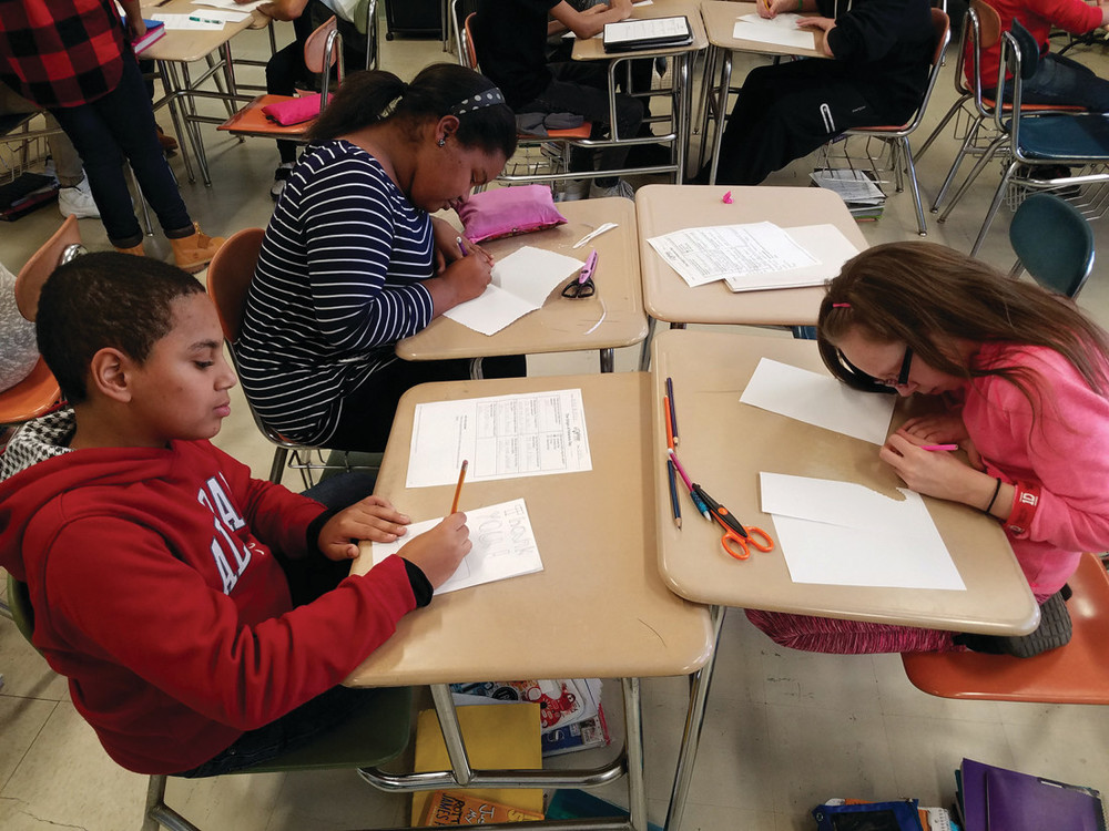 HARD AT WORK: After learning about the origins of Veterans Day and why it is celebrated, students at Park View Middle School began working hard to create cards and letters that would be sent to Rhode Island servicemen and women who are serving overseas and will not be home for the upcoming holidays.