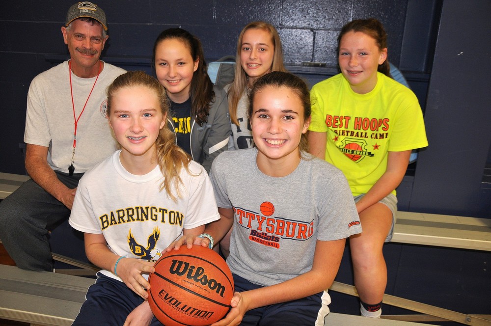 The Barrington Middle School girls' basketball team's starting cast includes (front, from left to right) Nina Gibbons and Hailey Walter, and (back row) Coach Mike Topazio, Leila Beers, Lea Rouleau and Grace Ceseretti.