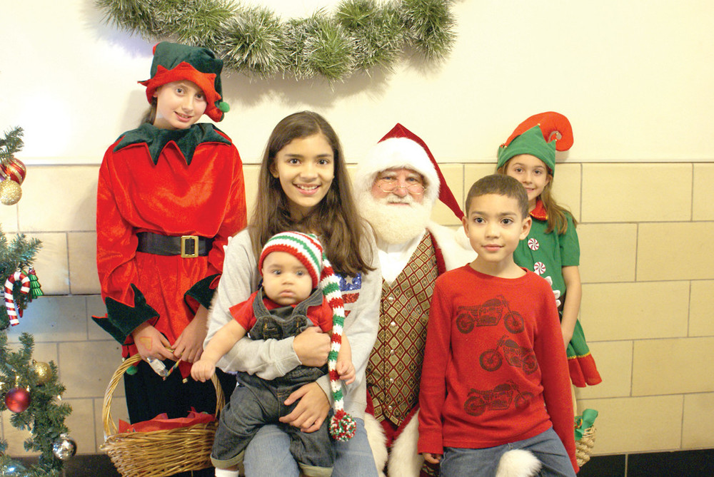 FAMILY PHOTO: The Ramirez family enjoyed their visit with Santa Claus, Elf Hailey and Elf Giuliana. Pictured are Jaileen, age 11, Jordan, age 4 months and Jayrome, age 5.