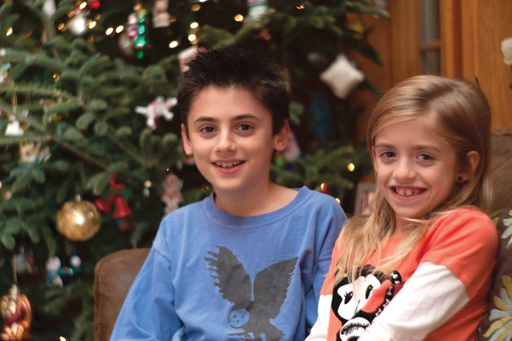 THE MAGIC OF THE SEASON: Pictured are siblings Jacob Morse, age 9, and Liliana Morse, age 7, whose lives have changed so much after the murder of their mother in Johnston. They were officially adopted by Jami and Jeff Morse last Christmas.