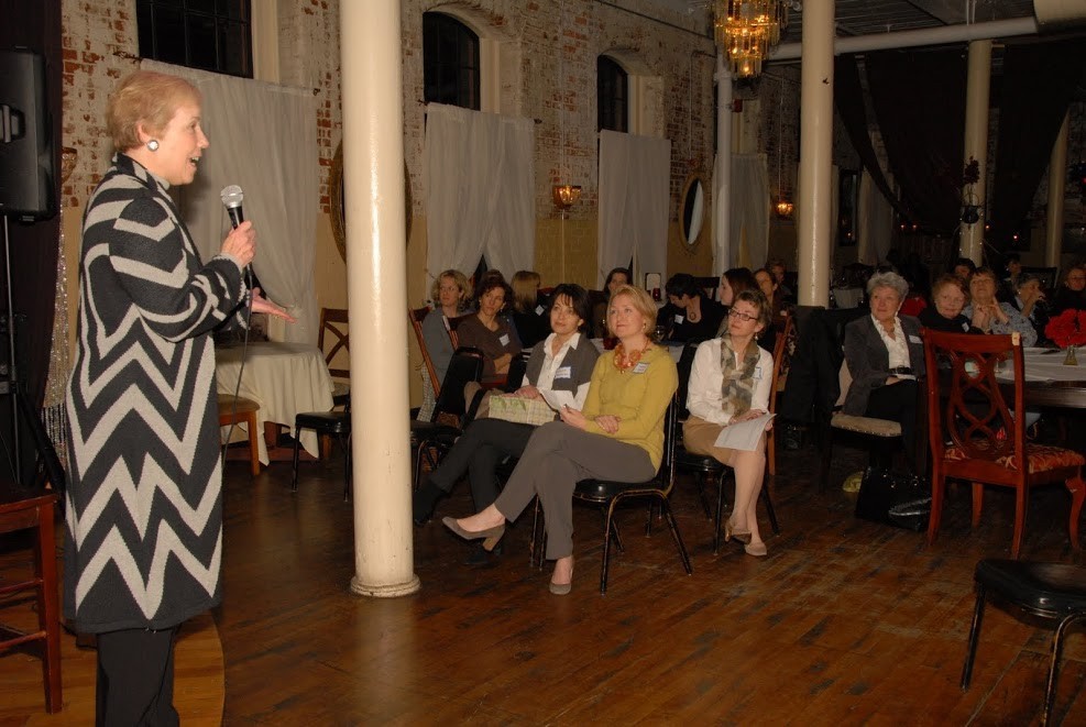 Marilyn Edwards, Co-Founder of 100+ Women Who Care RI, speaking at Hope Artiste Village