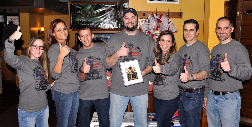 It was thumbs up at the second annual beer tasting event last Wednesday night at Aidan's Pub for the benefit of the First Sgt. P. Andrew McKenna Scholarship Fund. Hosting the event were several of Andrew's good friends, including left-right Gina-Marie Jorge, Philicia Pacheco, Scott Grimo, Cliff Jorge, Charlene Ferreira, Jonathan Ferreira, and Rob McKenna.