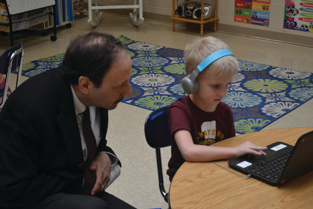 SHOWING WHAT HE&rsquo;S LEARNED: Michael DeAngelis demonstrates to Superintendent Dr. Bernard DiLullo how quickly he can navigate.