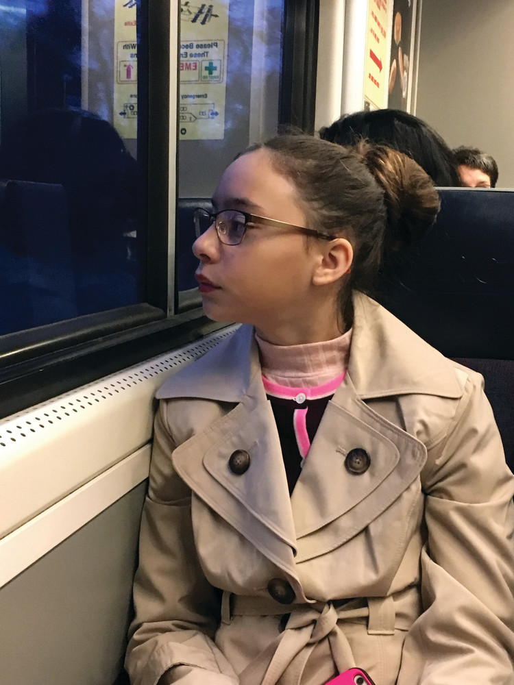 ON HER WAY: Emily Lopez gazes out the train window on her way to Washington, D.C.