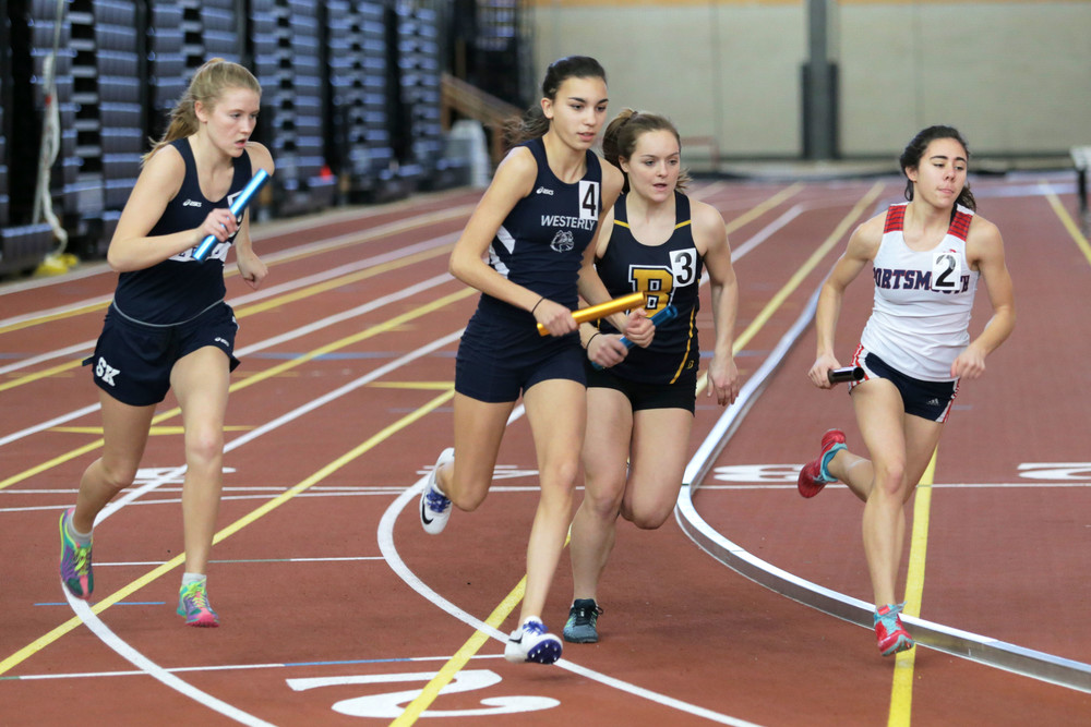 Portsmouth High senior Sofia White (right) competes in the 4x800-meter relay race. The Patriots came in first with a time of 10:16.70 and were the overall winners in the Medium Division.